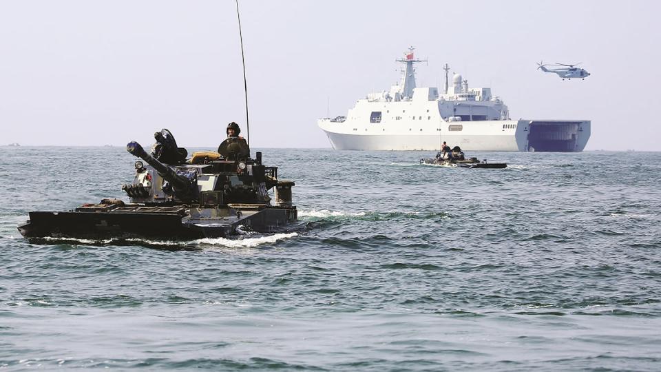 Amphibious armored vehicles attached to a brigade of the Chinese People's Liberation Army Navy Marine Corps make their way to a beach during maritime amphibious assault training in China's Guangdong province on Aug. 17, 2019. (Yan Jialuo and Yao Guanchen/Chinese Defense Ministry)