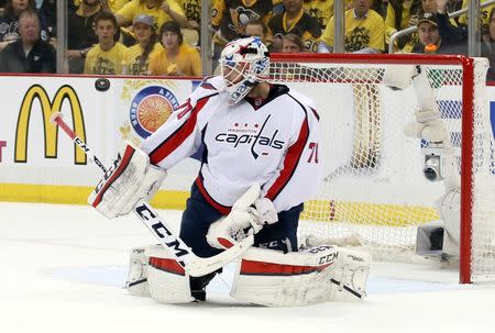 May 4, 2016; Pittsburgh, PA, USA; Washington Capitals goalie Braden Holtby (70) makes a save against the Pittsburgh Penguins during the first period in game four of the second round of the 2016 Stanley Cup Playoffs at the CONSOL Energy Center. Mandatory Credit: Charles LeClaire-USA TODAY Sports