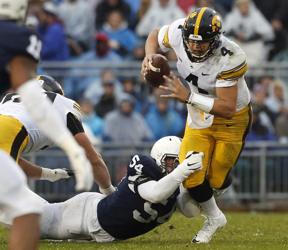 Penn State's Robert Windsor (54) sacks Iowa quarterback Nate Stanley (4) during the first half of an NCAA college football game in State College, Pa., Saturday, Oct. 27, 2018. (AP Photo/Chris Knight)