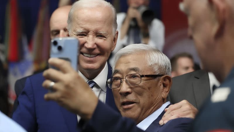 President Joe Biden poses for photos with attendees after he delivered remarks on the one-year anniversary of passage of the PACT Act, at the George E. Wahlen Department of Veterans Affairs Medical Center in Salt Lake City on Thursday, Aug. 10, 2023. He later held a fundraiser in Park City.