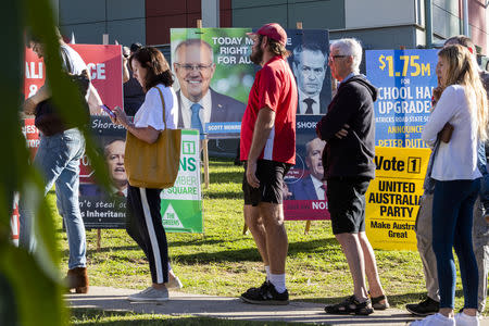 People voting in the seat of Dickson are seen arriving to vote at Patricks Road State School on Election Day in Brisbane, Queensland, Australia May 18, 2019. AAP Image/Glenn Hunt/via REUTERS