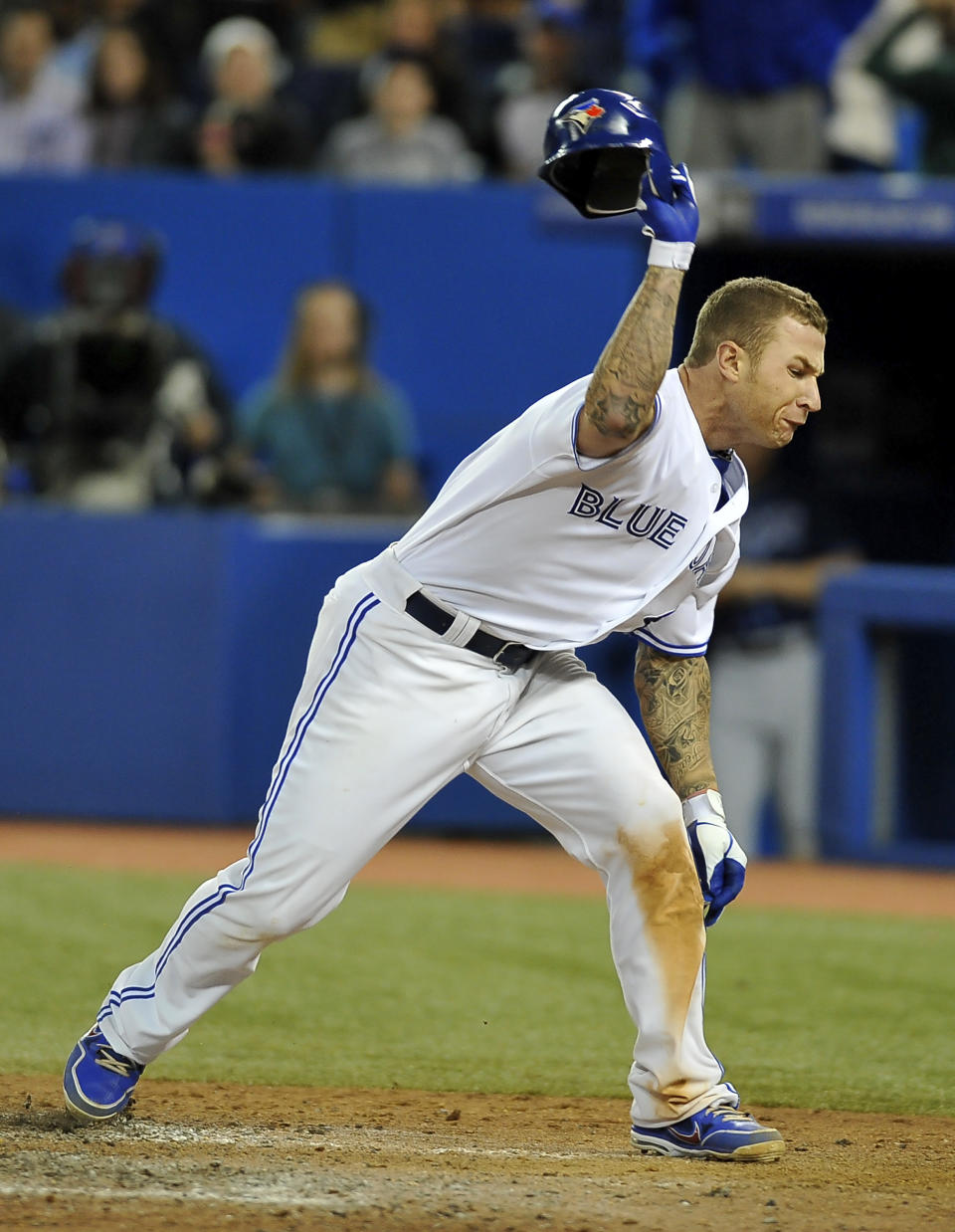 TORONTO, CANADA - MAY 15: Brett Lawrie #13 of the Toronto Blue Jays throws his batting helmet to protest a third strike call by Umpire Bill Miller (not pictured) during MLB game action the Tampa Bay Rays May 15, 2012 at Rogers Centre in Toronto, Ontario, Canada. (Photo by Brad White/Getty Images)