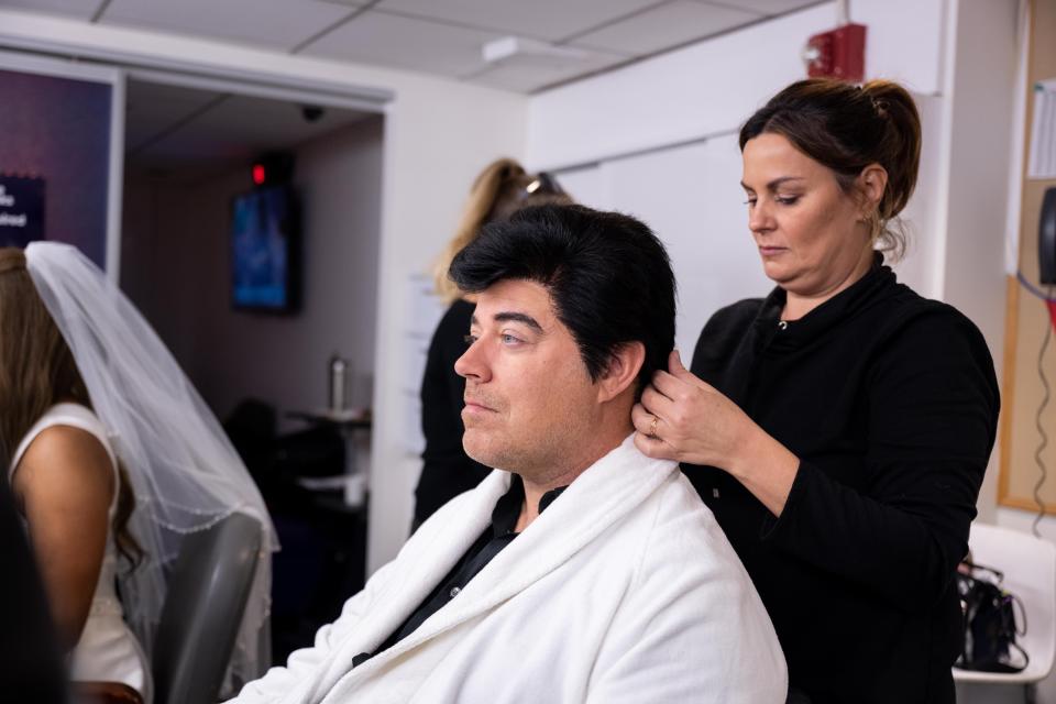 Carson Daly trying on his wig as David Copperfield. (Helen Healey / TODAY)