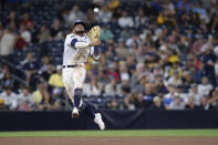 FILE - In this Aug. 8, 2019, file photo, San Diego Padres shortstop Fernando Tatis Jr. throws to first base late on a single by Colorado Rockies' Yonathan Daza during the sixth inning of a baseball game, in San Diego. Padres rookie shortstop Fernando Tatis Jr. has become one of major league baseball’s most exciting young players, showing an instinct and aggressiveness that make it hard to believe he’s only 20. (AP Photo/Orlando Ramirez, File)