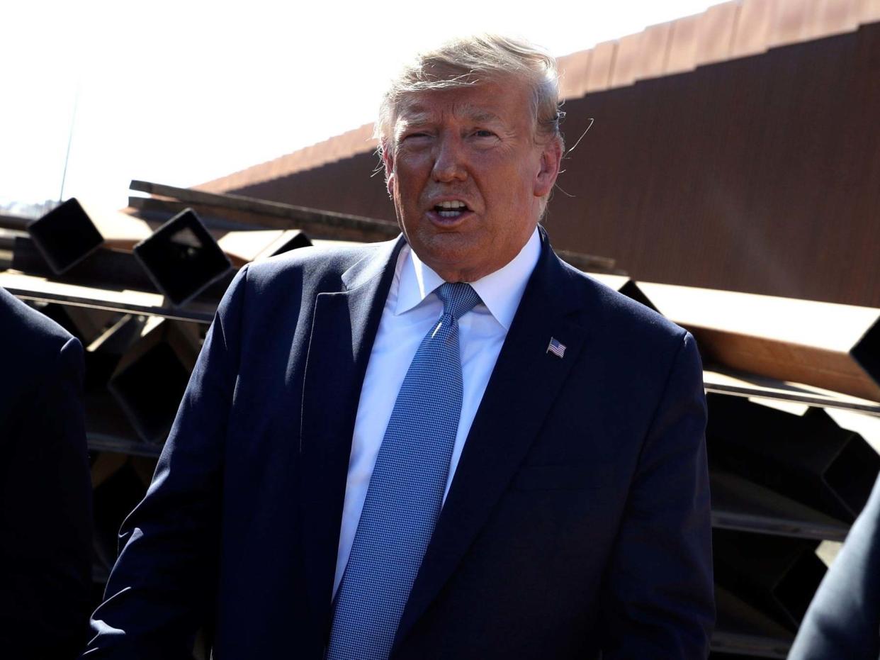 President Donald Trump talks with reporters as he tours a section of the southern border wall (file photo): AP