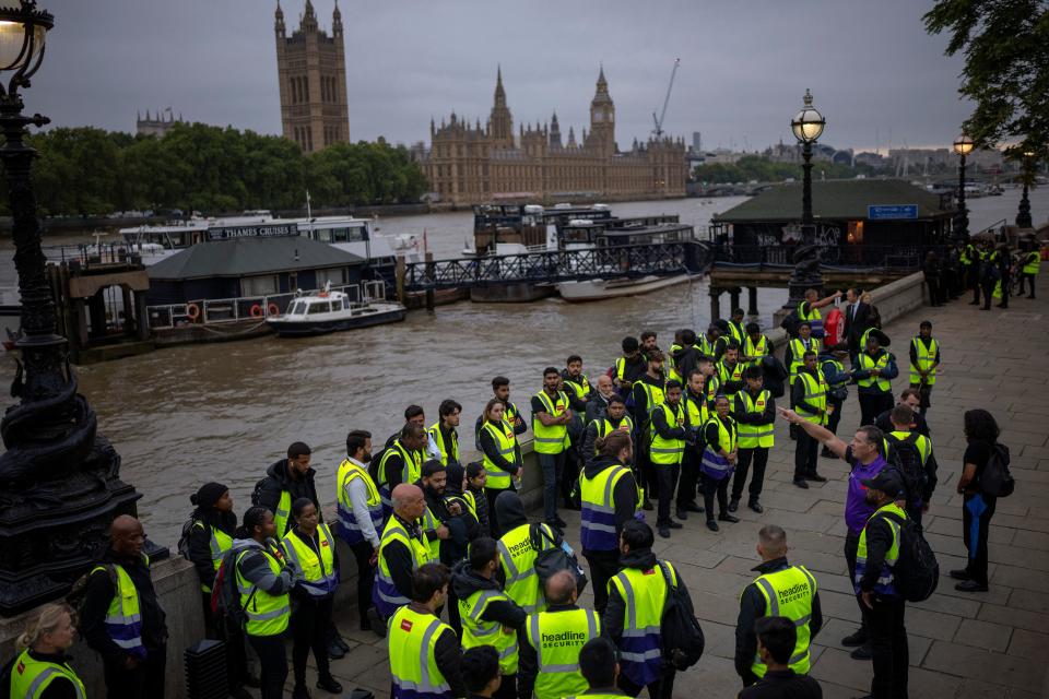 Security workers gather to be deployed near the Palace of Westminster in London (AP)
