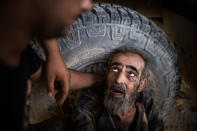 <p>A suspected ISIS member is being interrogated before sending him to Intelligence almost 250 meters from the Tigris River, in the western half of Mosul. The Tigris divides the city roughly into its western and eastern half, which was liberated from IS militants. West Mosul. Iraq. July 3, 2017. (Photograph by Diego Ibarra Sánchez / MeMo) </p>