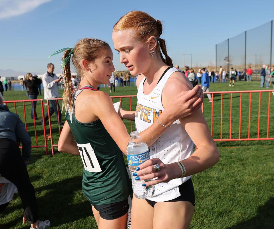 Winner Jane Hedengren of Timpview, right, congratulates second-place finisher Adria Favero of Olympus after the 5A girls cross-country state championship race at the Regional Athletic Complex in Rose Park on Tuesday, Oct. 24, 2023. | Jeffrey D. Allred, Deseret News