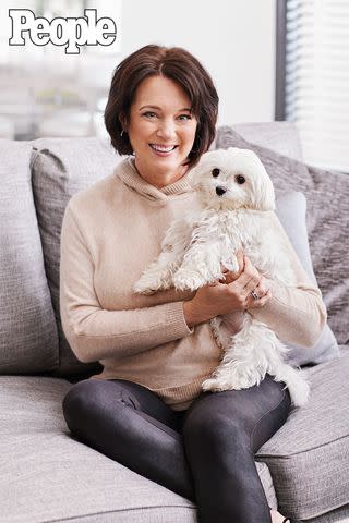 <p>Diana King</p> Rhonda Nelson, at home in Nashville with Sparkles, the couple's Maltese rescue. "She's the queen of the house."