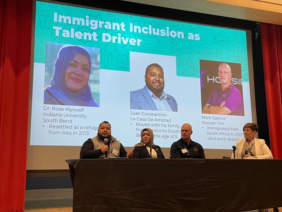 From left to right, immigrants Juan Constantino, Dr. Rose Alyousif, Mark Spence and South Bend-Elkhart Regional Partnership CEO Bethany Hartley speak during a panel Thursday, Dec. 7, 2023, at the St. Joseph County Public Library in downtown South Bend.