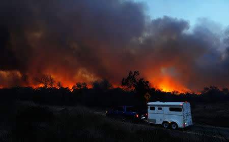 The Lilac Fire, a fast moving wildfire, continues to burn in Bonsall, California, U.S., December 7, 2017. REUTERS/Mike Blake