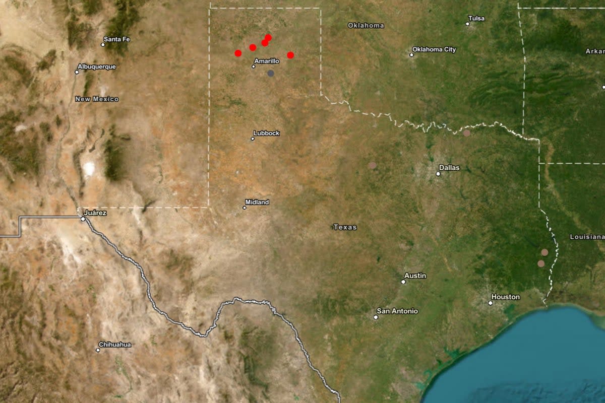 A map of Texas with red dots representing active fires, grey dots representing controlled fires and brown dots representing contained fires (Texas A&M Forest Service)