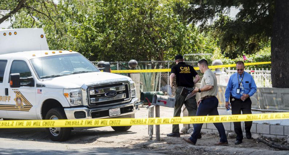 San Bernardino County Sheriff’s personnel investigate the scene of a fatal shooting where a four-year-old shot his two-year-old cousin. Source: AP