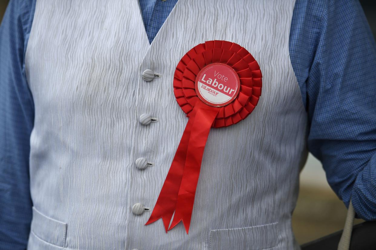 A Labour supporter sports a rosette in Batley, West Yorkshire on June 26, 2021, ahead of the Batley and Spen by-election taking place on July 1. (Photo by Oli SCARFF / AFP) (Photo by OLI SCARFF/AFP via Getty Images)