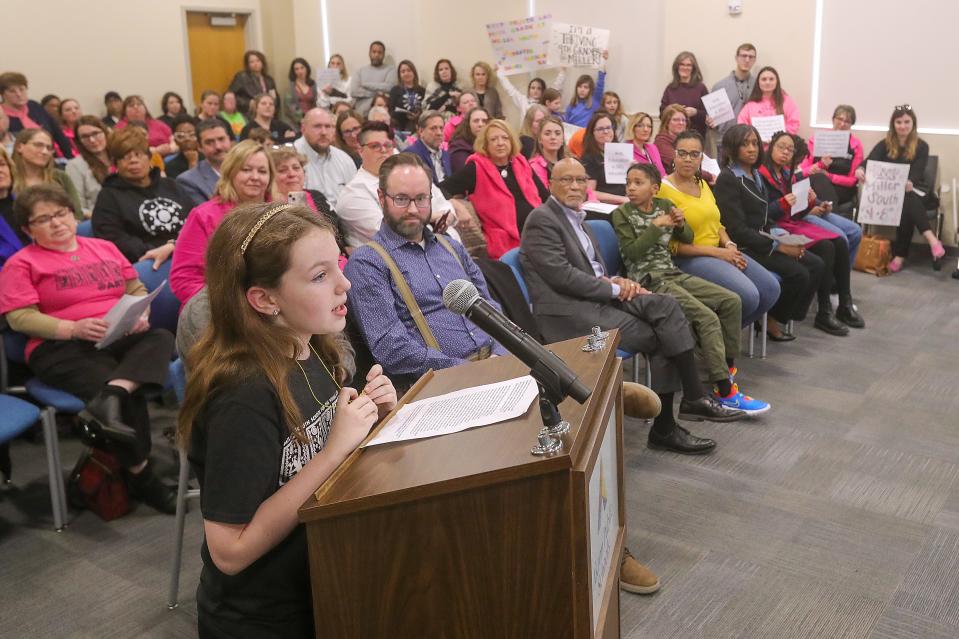 Miller South fifth grader Addy Whetsel addresses the Akron School Board during Monday's special meeting.