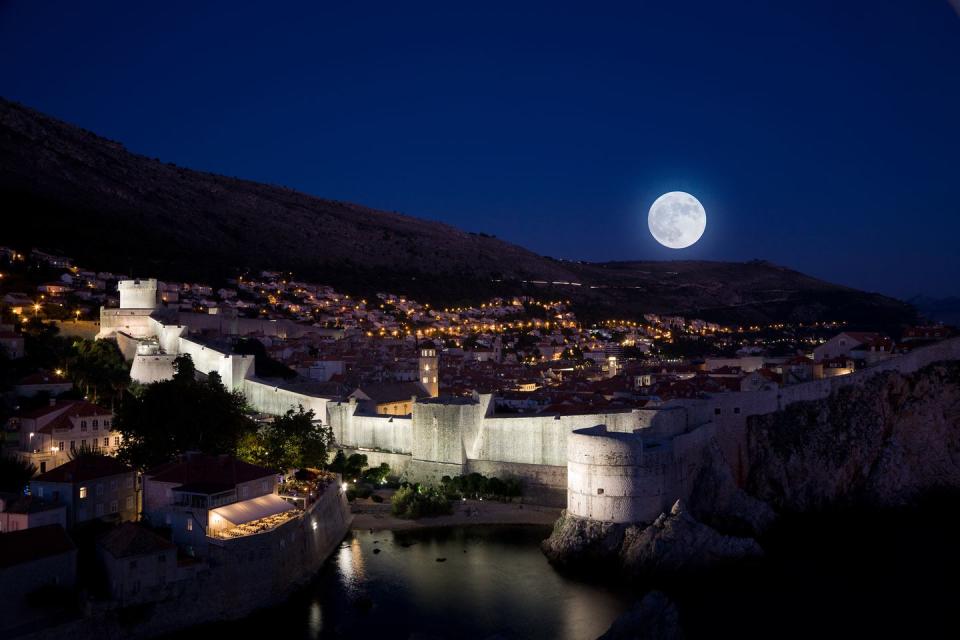 <p>There is something magnetic about cities that come alive at night and Dubrovnik, while not an obvious first suggestion, is one of those. Gorgeous during the day as well, this hotspot, made unforgettable by its appearances on <em>Game of Thrones</em>, also boasts killer views.</p><p>When the sun dips down behind the Adriatic Sea and the moon shines above, the city unveils a whole new side of its personality. The moon reflecting off the calm waters of the Old Port give the harbor walls an iridescent glow, and despite the panoramic views the city offers during the day, this is the most beautiful time of a day spent in Dubrovnik. After a late night of midnight marveling, the best place to rest your head is <a rel="nofollow noopener" href="http://www.villa-dubrovnik.hr/" target="_blank" data-ylk="slk:Villa Dubrovnik;elm:context_link;itc:0;sec:content-canvas" class="link ">Villa Dubrovnik</a>. Overlooking the turquoise waters and nestled amongst orange and lemon groves, this boutique hotel is the most peaceful place to wake up after a night on the town–and their many terraces allow you to take in the old city's stunning views.</p>