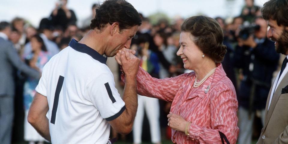 <p>Giving his mom a big kiss on the hand after she presented him with a prize at a polo match in Windsor. </p>
