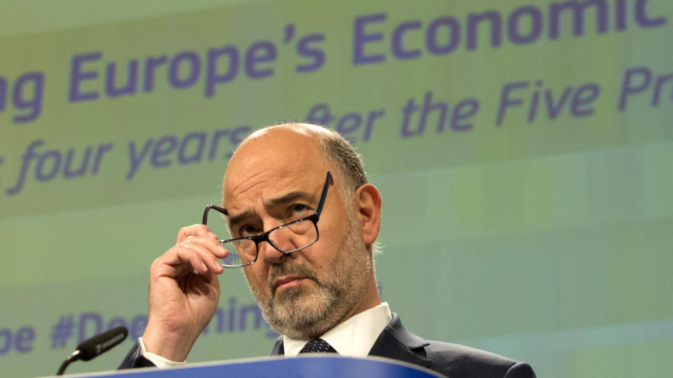 European Commissioner for Economic and Financial Affairs Pierre Moscovici pauses before speaking during a media conference at EU headquarters in Brussels, Wednesday, June 12, 2019. The European Commission on Wednesday took stock of the progress made to deepen Europe's Economic and Monetary Union and calls on Member States to take further concrete steps. (AP Photo/Virginia Mayo)