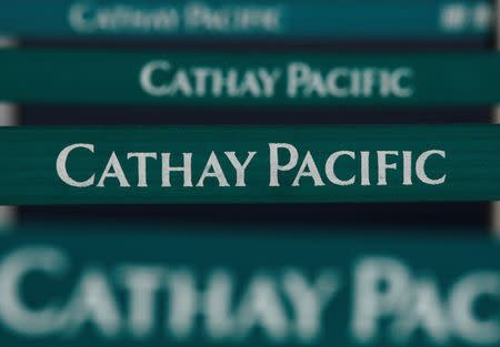 Belts are seen in front of a Cathay Pacific Airways check-in counter at the Hong Kong Airport March 11, 2009. REUTERS/Bobby Yip/Files