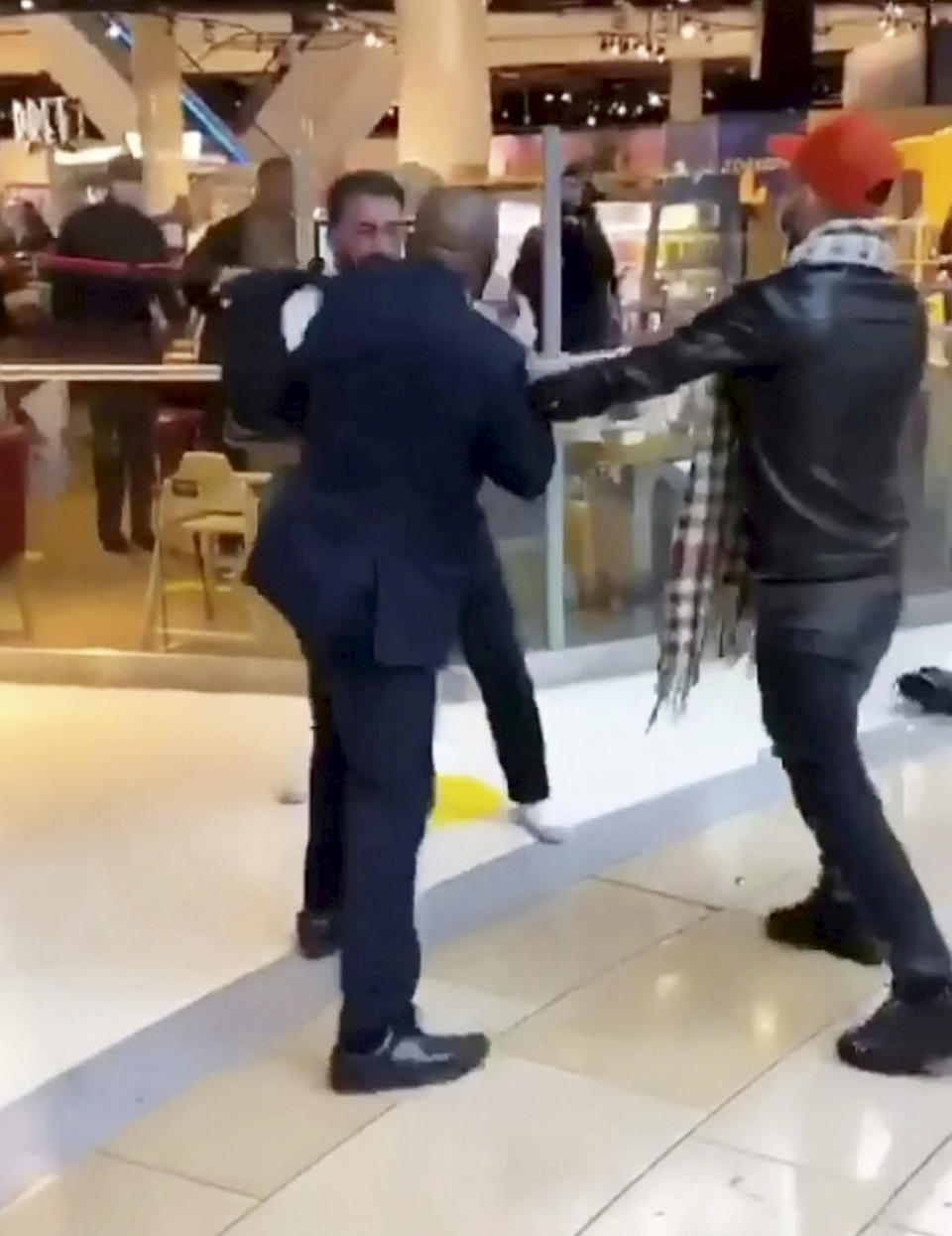 This is the shocking moment a security guard and a shopper viciously brawled outside a Selfridges following a row about entering the store with rollerblades. The smartly-dressed security worker traded punches with the irate customer after violence erupted at Birmingham's Bull Ring shopping centre on Saturday (26/9). The pair can be seen adopting boxing stances before exchanging blows in front of stunned shoppers at the entrance of the posh department store. In the footage, obtained by website Birmz Is Grime, one man can be heard saying "chill man" before the video ends with two burly men continuing to swing punches.