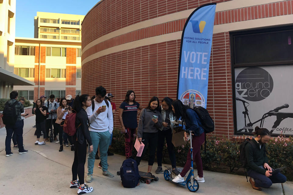 Voters wait on line at a polling station at the University of Southern California on Tuesday, March 3, 2020. Some California voters are waiting in long lines because of technical glitches connecting to the statewide voter database or too many users trying to cast ballots at once. The secretary of state's office said election workers in 15 counties could not connect to the statewide voter registration database on Super Tuesday but that the issues have been resolved. (AP Photo/Stefanie Dazio)