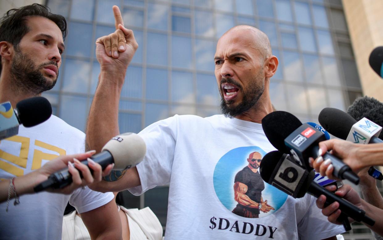 Andrew Tate speaks outside the court in Bucharest after he was placed under house arrest