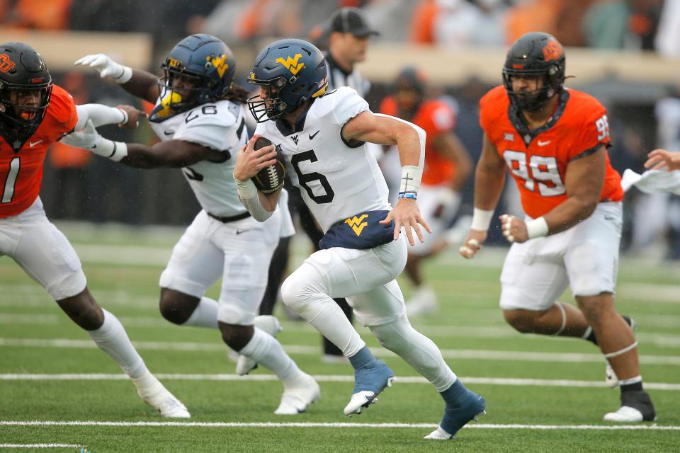 West Virginia Mountaineers quarterback Garrett Greene (6) runs during a college football game between Oklahoma State and West Virginia at Boone Pickens Stadium in Stillwater, Okla., Saturday, Nov. 26, 2022.