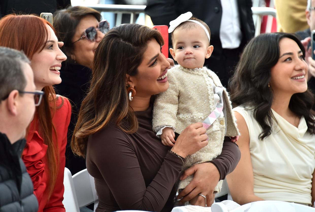 Sophie Turner, from left, Priyanka Chopra and her daughter Malti Marie Chopra Jonas attend a ceremony honoring The Jonas Brothers with a star on The Hollywood Walk of Fame in Los Angeles on Jan. 30, 2023.