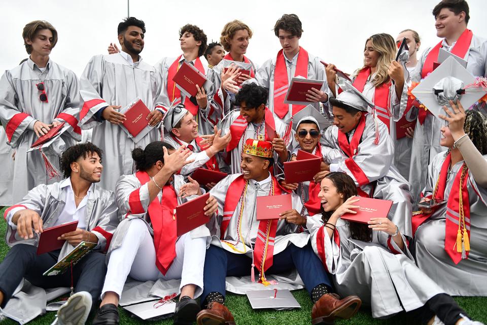 Vineland High School seniors celebrate following the commencement ceremony at Gittone Stadium on Wednesday, June 22, 2022.