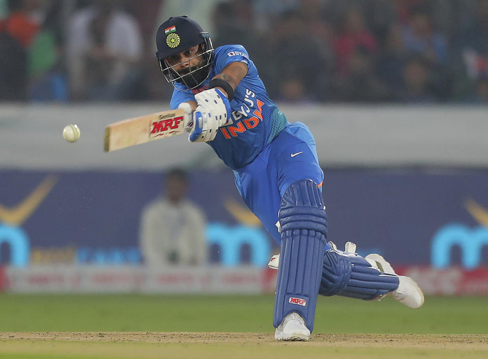 India's captain Virat Kohli plays a shot during the first Twenty20 international cricket match between India and West Indies in Hyderabad, India, Friday, Dec. 6, 2019. (AP Photo/Mahesh Kumar A.)