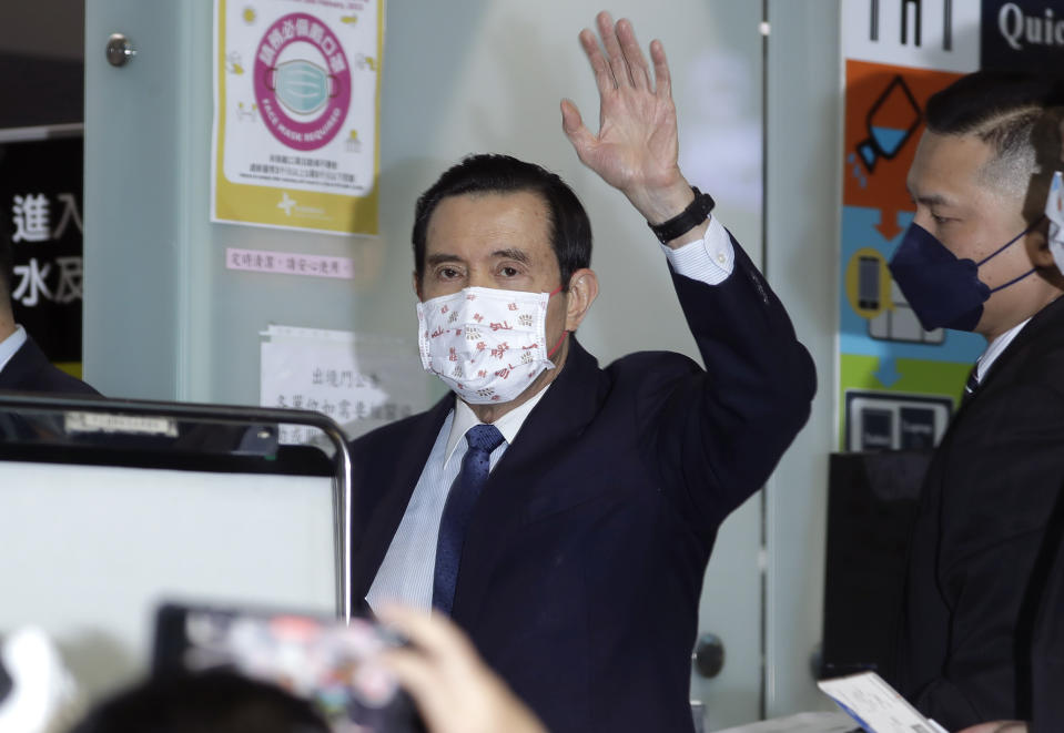 Former Taiwan President Ma Ying-jeou waves as Ma leaves for China, at Taoyuan International Airport in Taoyuan City, northern Taiwan, Monday, March 27, 2023. Ma will visit China in what a spokesman called a bid to ease tensions between the self-ruled island and the mainland. (AP Photo/Chiang Ying-ying)