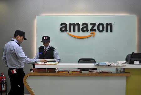 Security guards stand at the reception desk of the Amazon India office in Bengaluru, India, August 14, 2015. REUTERS/Abhishek N. Chinnappa/Files