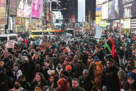 Demonstrators gather during a protest in Times Square on Saturday, Jan. 28, 2023, in New York, in response to the death of Tyre Nichols, who died after being beaten by Memphis police during a traffic stop. (AP Photo/Yuki Iwamura)