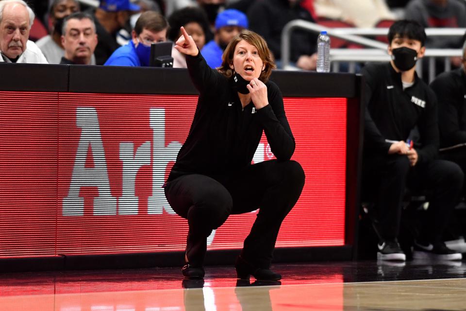 Duke assistant head coach Beth Cunningham shouts instructions to her team during the second half of an NCAA college basketball game against Louisville in Louisville, Ky., Sunday, Jan. 30, 2022. (AP Photo/Timothy D. Easley)