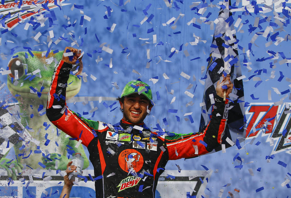 Chase Elliott celebrates after winning a NASCAR Cup Series auto race at Talladega Superspeedway, Sunday, April 28, 2019, in Talladega, Ala. (AP Photo/Butch Dill)