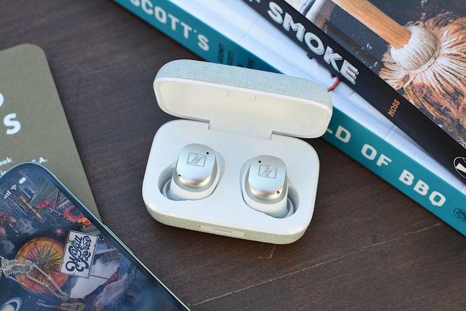 <p>White/silver Sennheiser Momentum True Wireless 4 earbuds sitting in their case with the lid open.</p>
