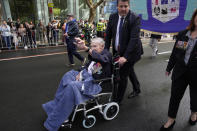 Veteran Berick Bouvier is pushed in his wheelchair during the Anzac Day march in Sydney, Monday, April 25, 2022. Australia and New Zealand commemorate Anzac Day every April 25, the date in 1915 when the Australia and New Zealand Army Corps landed on Turkey in an ill-fated campaign that created the soldiers' first combat of World War I. (AP Photo/Rick Rycroft)