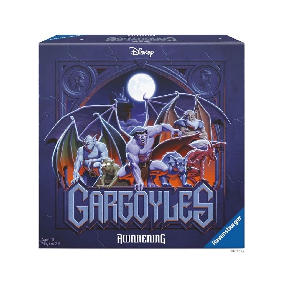 Front cover of the box for the Gargoyles board games, which shows the characters in front of the mon