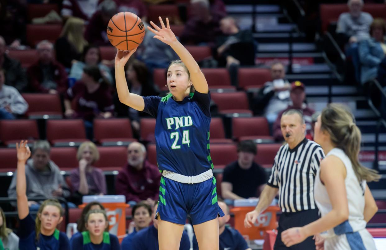 Peoria Notre Dame's Lexi Baer (24) puts up a three-pointer against Wilmette Regina Dominican in the second half of their Class 2A girls basketball state semifinal Thursday, Feb. 29, 2024 at CEFCU Arena in Normal. The Irish routed the Panthers 71-25.