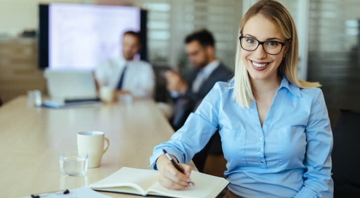 A real estate partner reviewing the terms of her partnership.