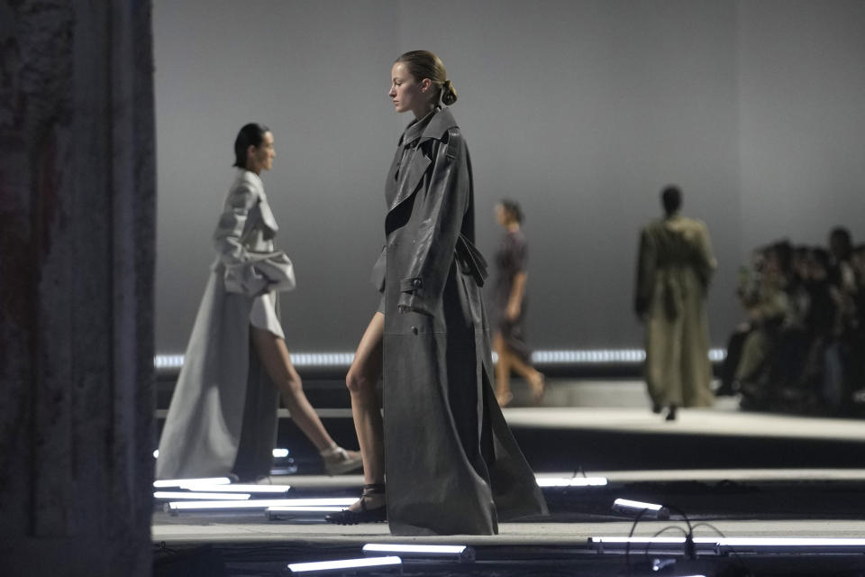 Models wear creation as part of the Tod's women's Fall-Winter 2023-24 collection presented in Milan, Italy, Friday, Feb. 24, 2023. (AP Photo/Luca Bruno)