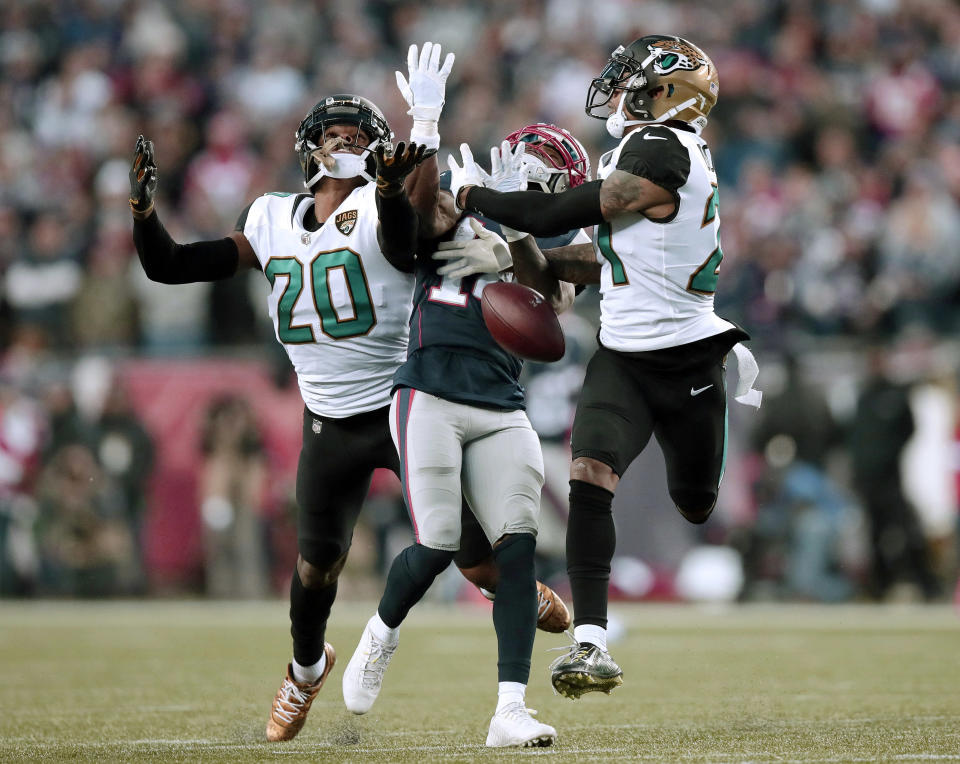 <p>Jacksonville Jaguars cornerbacks Jalen Ramsey (20) and A.J. Bouye (21) break up a pass intended for New England Patriots wide receiver Brandin Cooks (14) during the second half of the AFC championship NFL football game, Sunday, Jan. 21, 2018, in Foxborough, Mass. (AP Photo/Charles Krupa) </p>