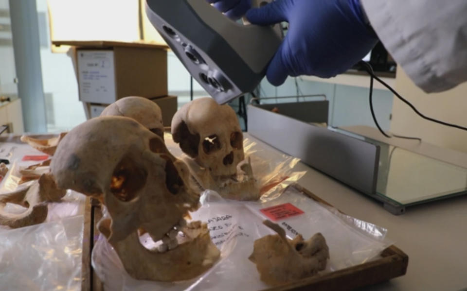 In this grab taken from video on Wednesday, May 19, 2021, a scientist controls a 3D scanner over the alleged remains of bones of Christopher Columbus and family members, in the Anthropology Laboratory at Granada University in Granada, Spain. Was Christopher Columbus really from Genoa, in Italy? Or was he Spanish? A definitive answer to the question of where the famous explorer came from could be just five months away as international scientists on Wednesday launched an effort to read the DNA from his remains and identify his geographic origin. (AP)