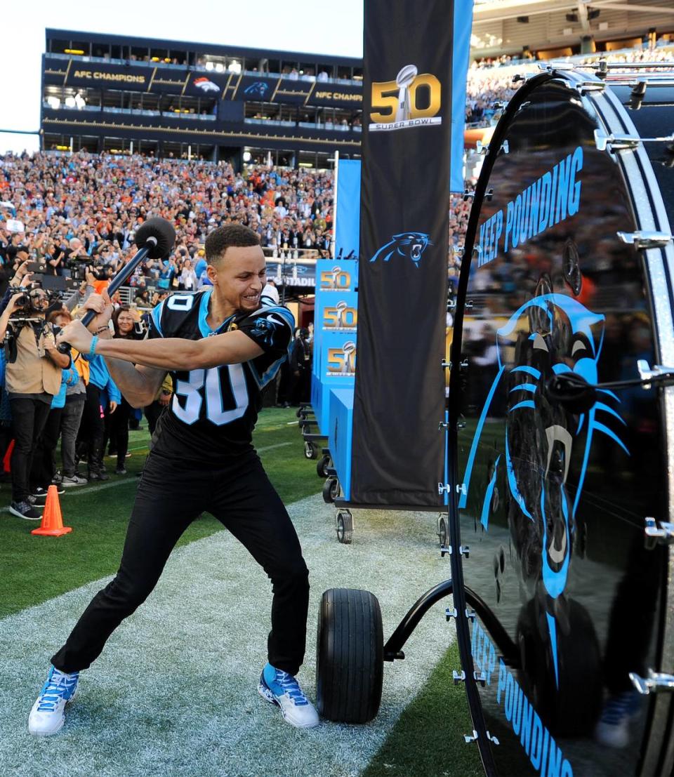 NBA star Stephen Curry grits his teeth as he hits the Carolina Panthers Keep Pounding Drum at Levi’s Stadium in Santa Clara, CA. on Sunday, February 7, 2016 prior to Super Bowl 50. The Denver Broncos defeated the Carolina Panthers 24-10 in Super Bowl 50.