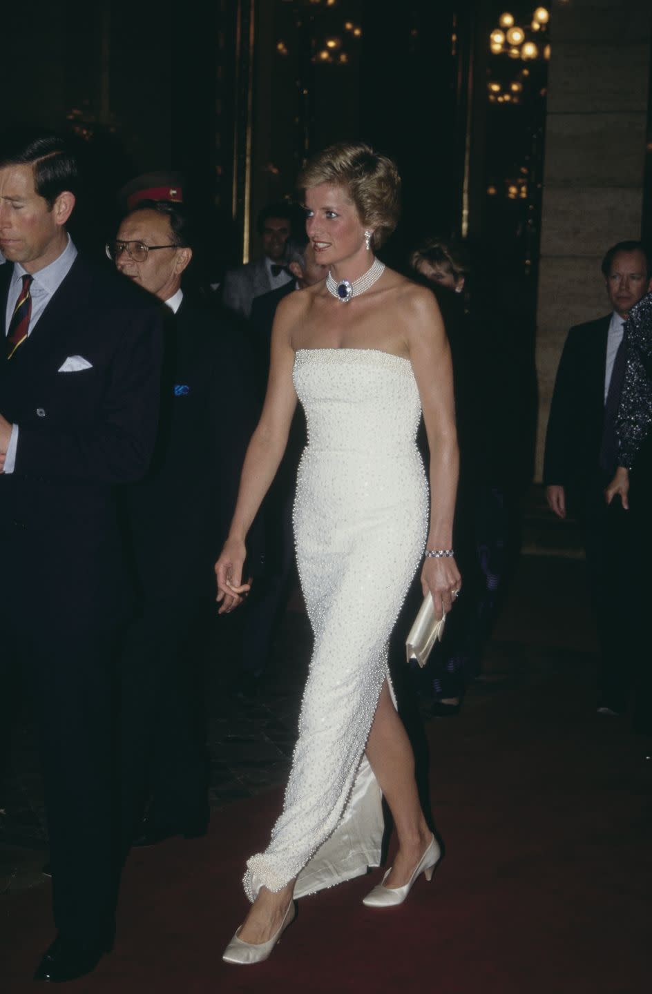 <p>For a dinner in Hungary in 1990, Princess Diana accessorized her Catherine Walker gown with her beloved sapphire and pearl choker. </p>