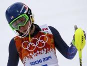 Mikaela Shiffrin of the U.S. reacts in the finish area after competing in the first run of the women's alpine skiing slalom event during the 2014 Sochi Winter Olympics at the Rosa Khutor Alpine Center February 21, 2014. REUTERS/Leonhard Foeger (RUSSIA - Tags: SPORT OLYMPICS SPORT SKIING)