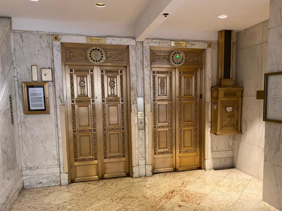 two gold elevators at the congress plaza hotel in chicago