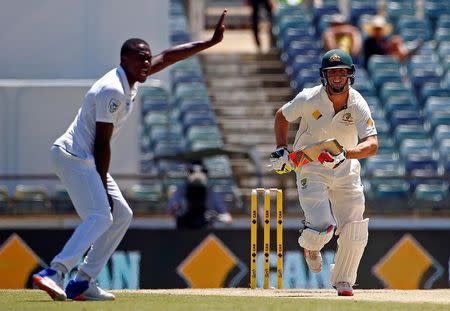 Cricket - Australia v South Africa - First Test cricket match - WACA Ground, Perth, Australia - 7/11/16. South Africa's Kagiso Rabada appeals successfully for LBW to dismiss Australia's Mitchell Marsh at the WACA Ground in Perth. REUTERS/David Gray