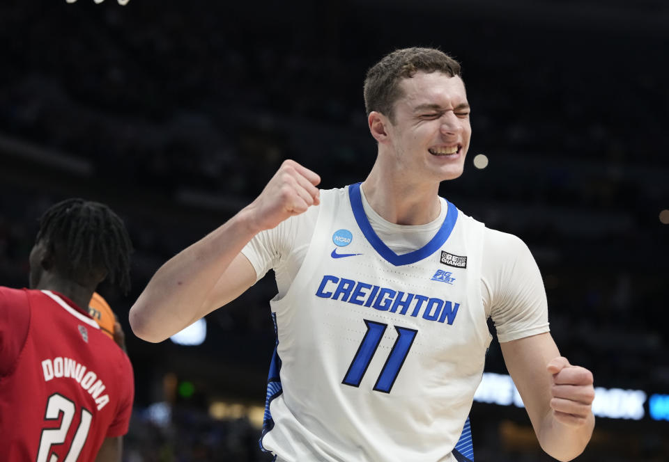 Creighton center Ryan Kalkbrenner celebrates after scoring a basket and drawing a foul late in the second half of a first-round college basketball game against North Carolina State in the men's NCAA Tournament, Friday, March 17, 2023, in Denver. (AP Photo/David Zalubowski)