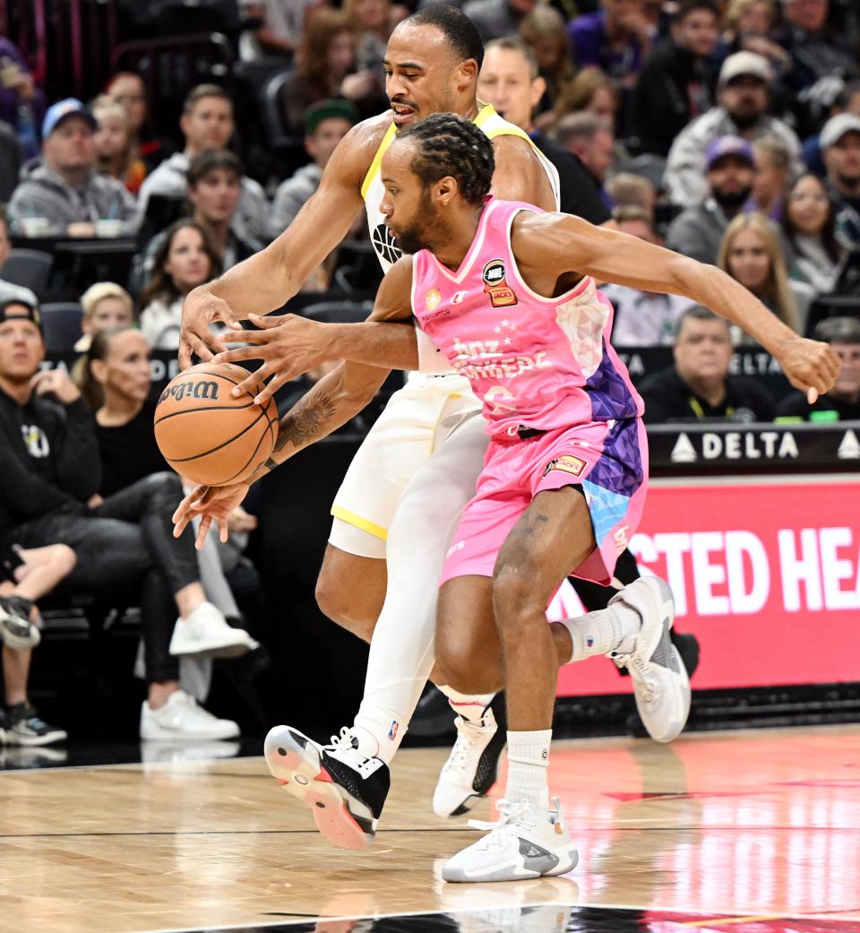 Utah Jazz guard <a class="link " href="https://sports.yahoo.com/nba/players/6234" data-i13n="sec:content-canvas;subsec:anchor_text;elm:context_link" data-ylk="slk:Talen Horton-Tucker;sec:content-canvas;subsec:anchor_text;elm:context_link;itc:0">Talen Horton-Tucker</a> (5) is hit by Breakers’ Parker Jackson-Cartwright as the Utah Jazz and the New Zealand Breakers play at the Delta Center in Salt Lake City on Monday, Oct. 16, 2023. | Scott G Winterton, Deseret News